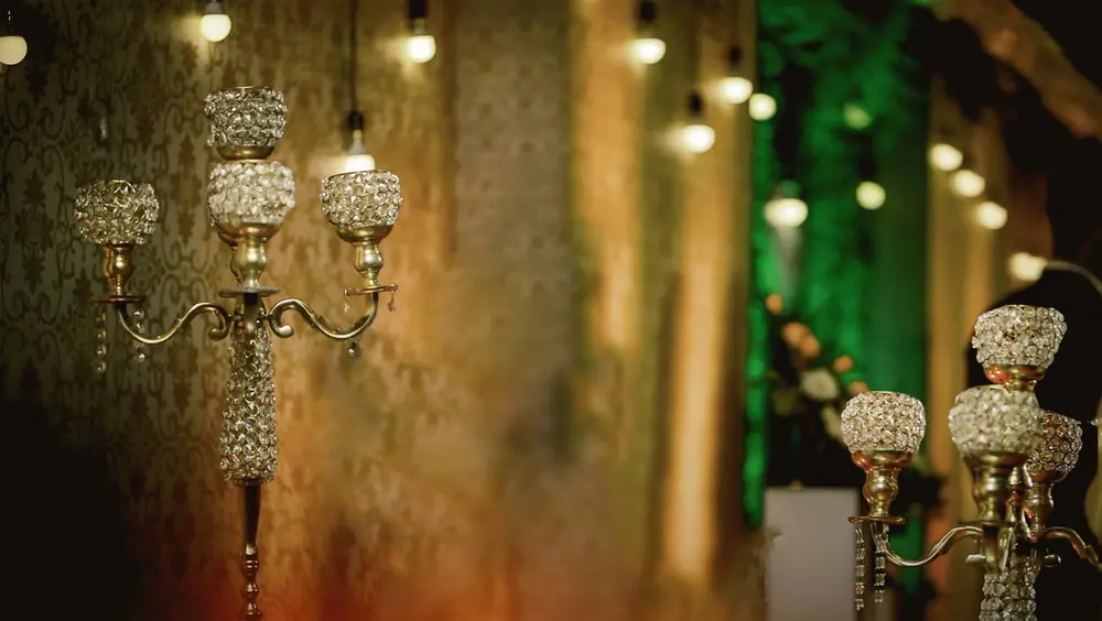 Crystal candelabra glowing against a warm, softly lit backdrop