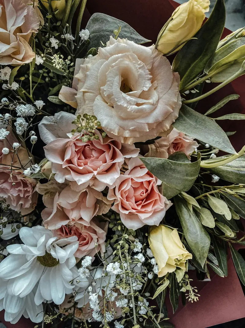 Blush roses and lisianthus with gypsophila